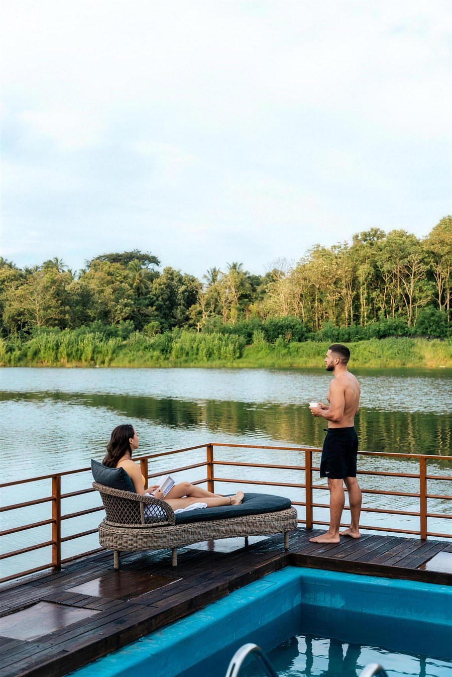 Guests on a deck above the floating pool