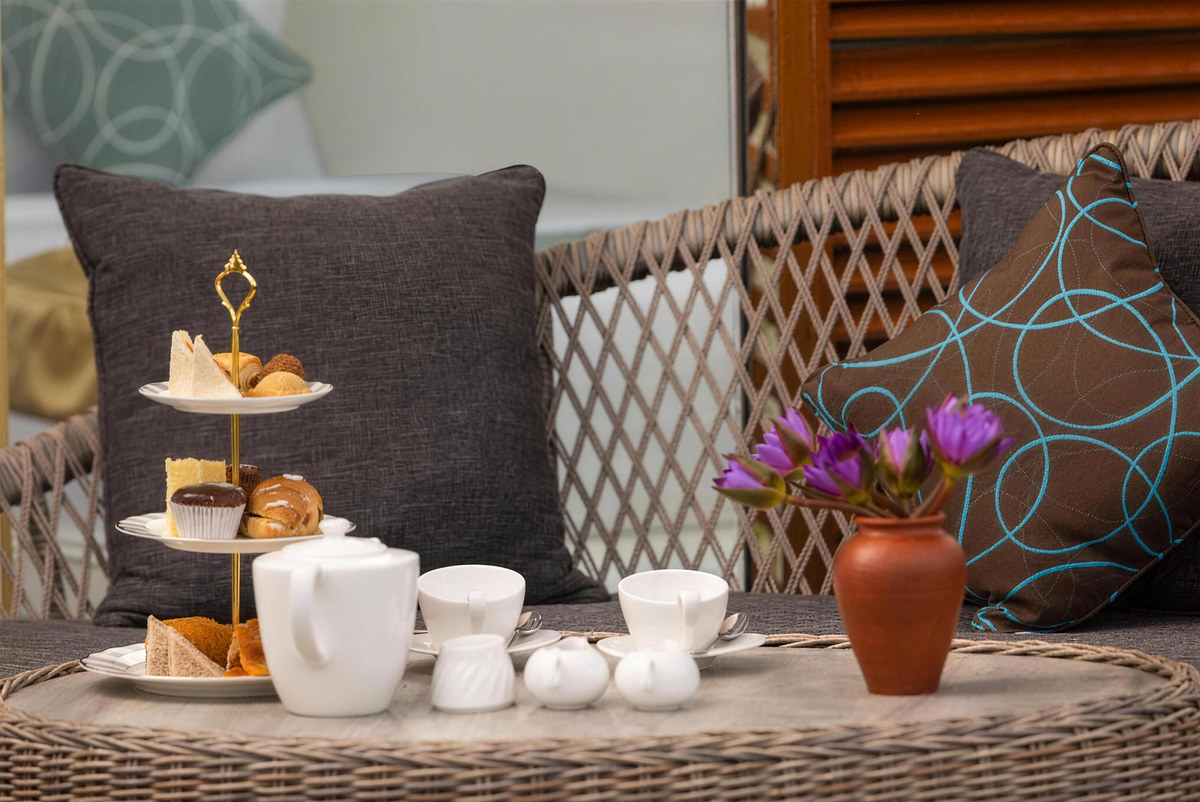 High tea laid out on a cabana deck