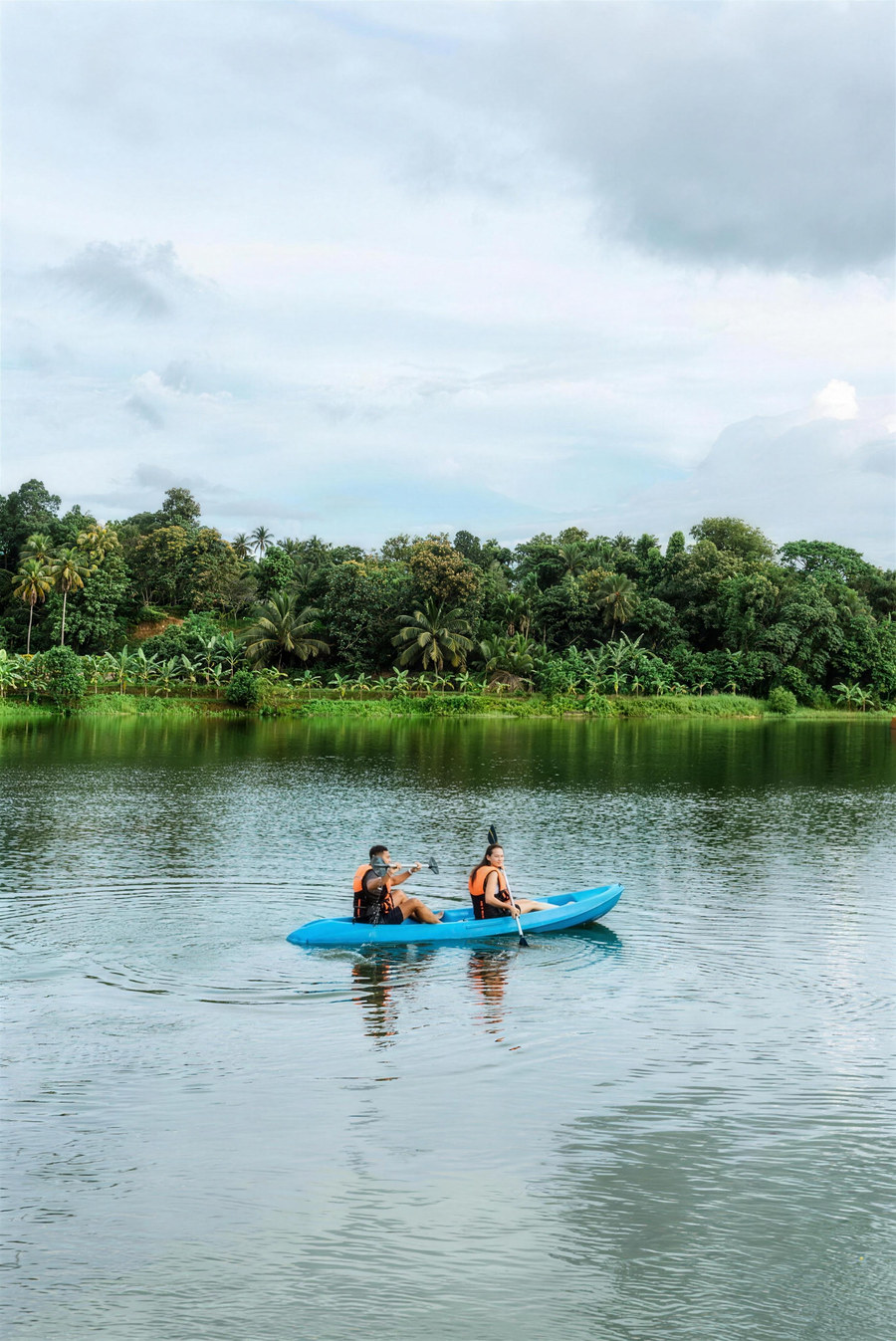A guest kayaking on the lake