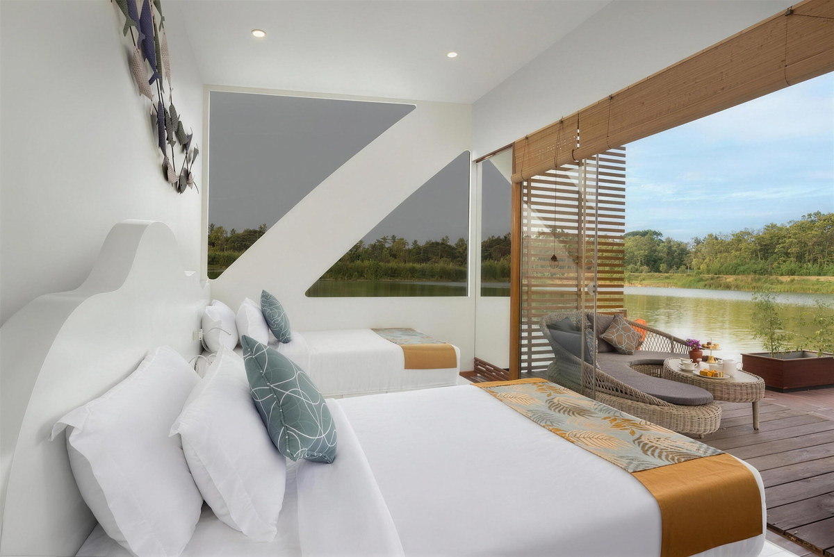 A cabana bedroom opening onto the lake